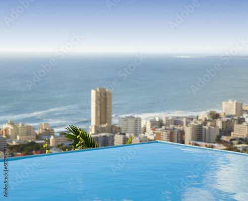 Travel  vacation and pool in city with ocean and hotel view in Cape Town with nobody  buildings and urban beach property. Cityscape  sea and blue sky at luxury accommodation for summer holiday trip.