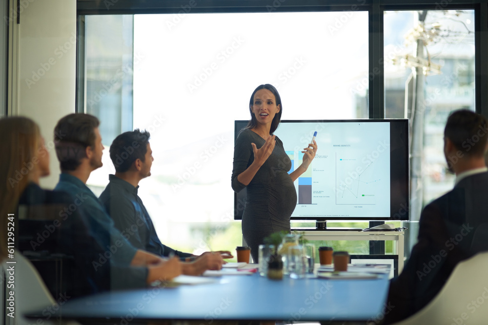 Fototapeta premium Pregnant, business woman and startup presentation at a teamwork workshop with speech and communication. Manager, female pregnancy and company learning with staff and boss with sales graph strategy