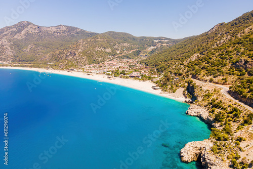 Oludeniz resort village on Aegean sea coast in Turkey, aerial wide shot © Leonid