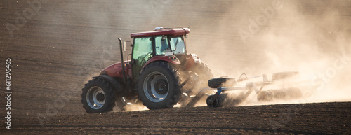 Принти на полотні Tilling the soil: a tractor cultivator in action