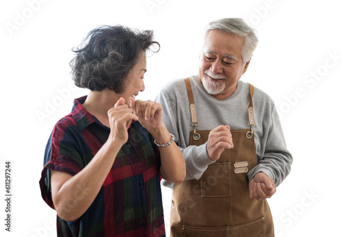 Asian mature senior couple is dancing and smiling in kitchen at home. isolated white background, remove background