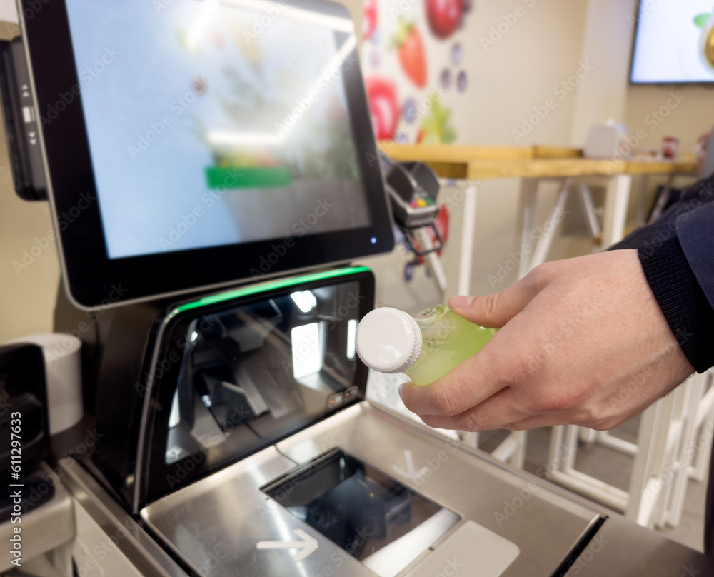 Customer pays his purchase at the supermarket,self checkout systems in retail stores,Barcode scanner,Self checkout machine Customer pays his purchase at the supermarket,self checkout systems in retail stores,Barcode scanner,Self checkout machine