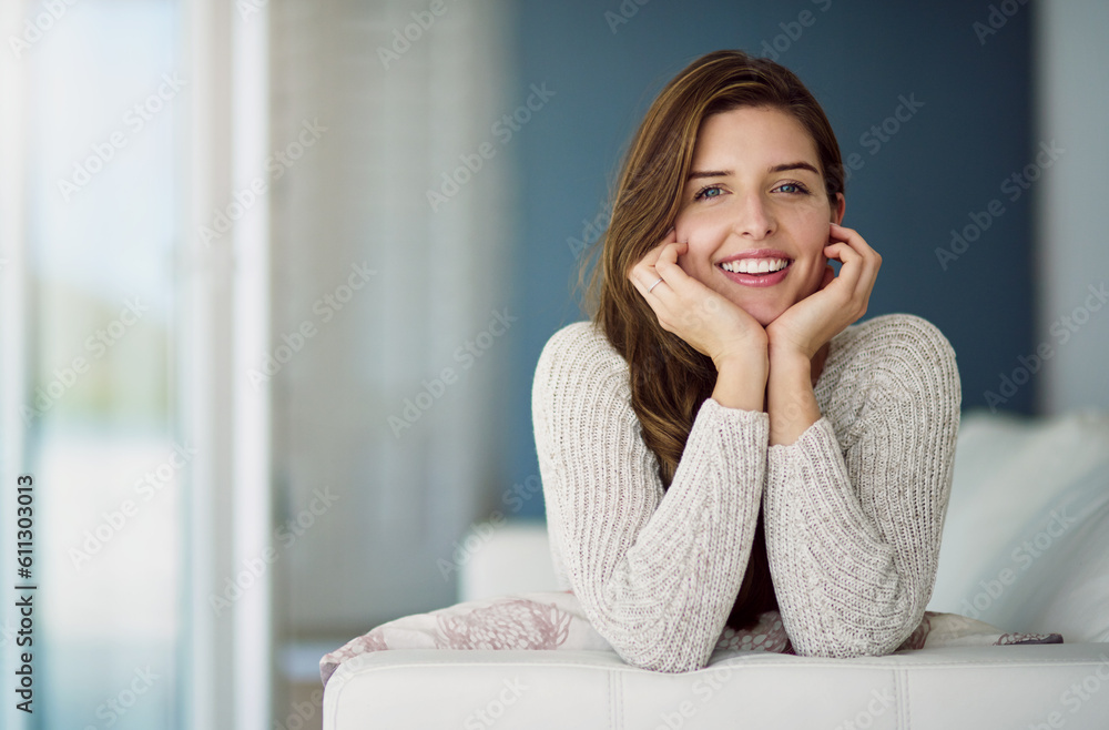 Smile, portrait and woman relax on couch in home living room on holiday. Face, happy and young female person from Canada on sofa in lounge, apartment or house to enjoy me time, vacation or lifestyle.