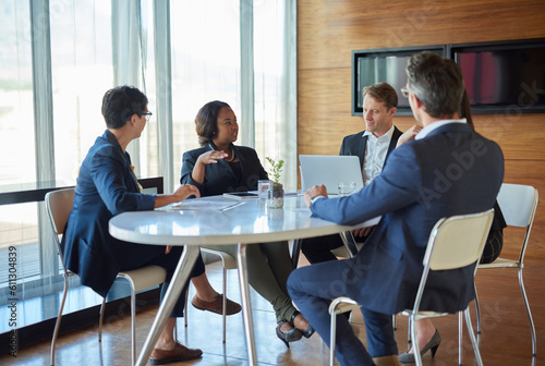 Business, meeting and discussion with teamwork or strategy at company for success with project. Professional, group and conversation on conference room for brainstorming for a partnership at office.