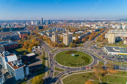 Vilnius Cityscape Zirmunai District Roundabout Autumn Trees and Traffic. Lithuania