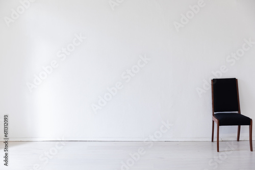 Fototapeta Naklejka Na Ścianę i Meble -  black chair on a white background interior in a bright room