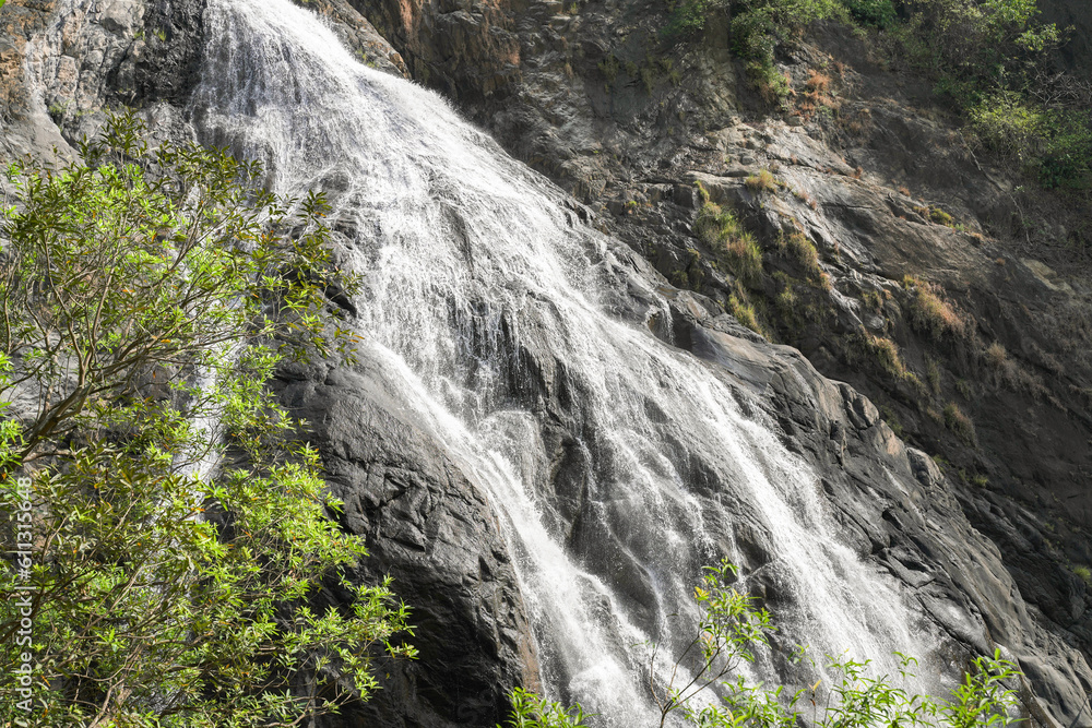 Big Mountain Waterfall cascade on mountain rocks