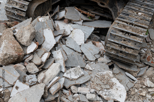 Backhoe wheel on demolition site photo