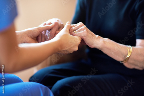 Doctor, senior people and holding hands for support, healthcare service and medical, advice and empathy. Professional nurse, helping and retirement nursing for elderly person in together sign closeup