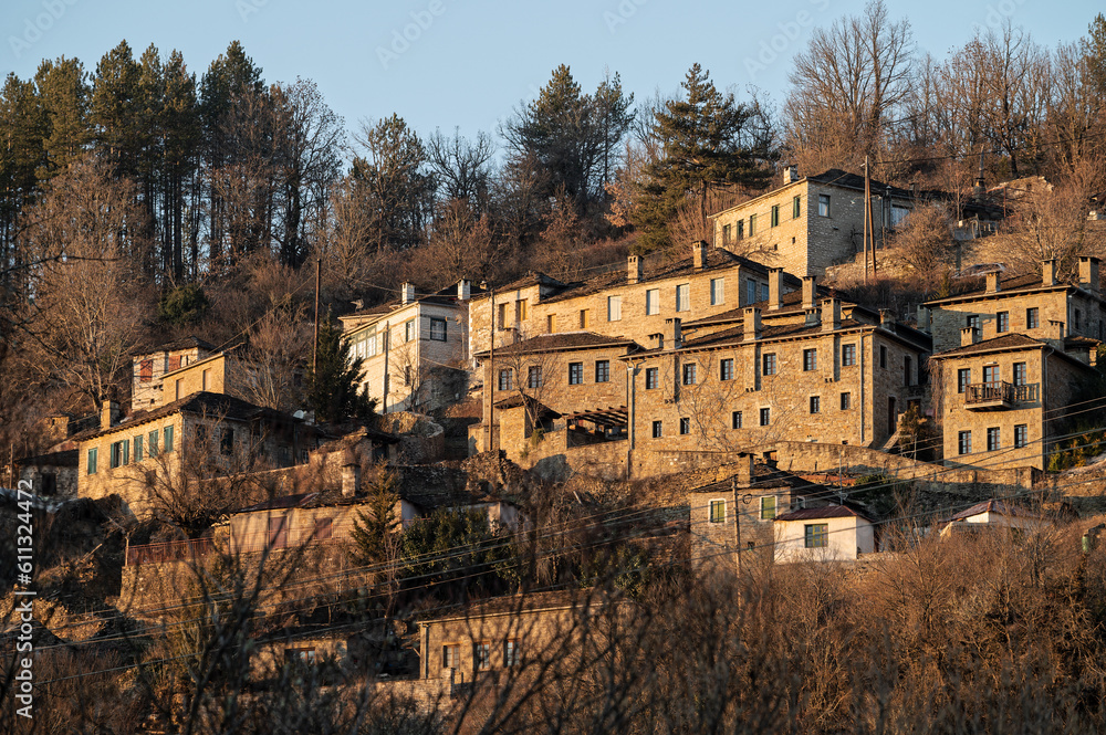Stone houses of traditional architecture in Kipoi, in Zagori of Epirus, Greece at sunset