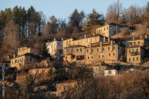 Stone houses of traditional architecture in Kipoi, in Zagori of Epirus, Greece at sunset