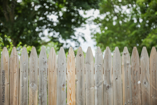 Wooden fence represents boundaries, security, privacy, natural beauty, rustic charm, and a connection to nature