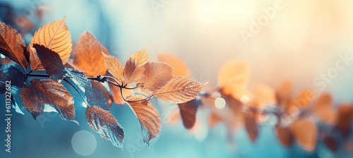 Panoramic image of a branch in autumn. Fall seasonal colors. Blue background. Generative AI
