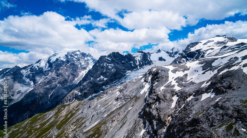Obraz premium View from the Stelvio Pass, the highest automobile pass in Italy, located between Trentino-Alto Adige and Lombardy, Italy. Ecologia and photo tourism concept.