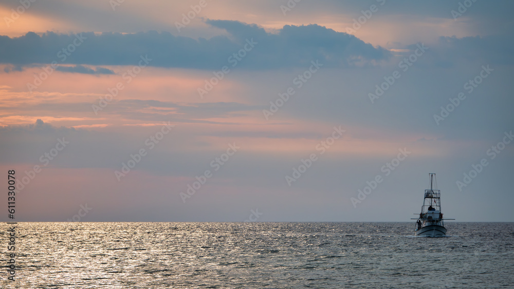 Fishing Trawler in Gokceada sea at sunset. Canakkale, Turkey Fishing Trawler in Gokceada sea at sunset. Canakkale, Turkey