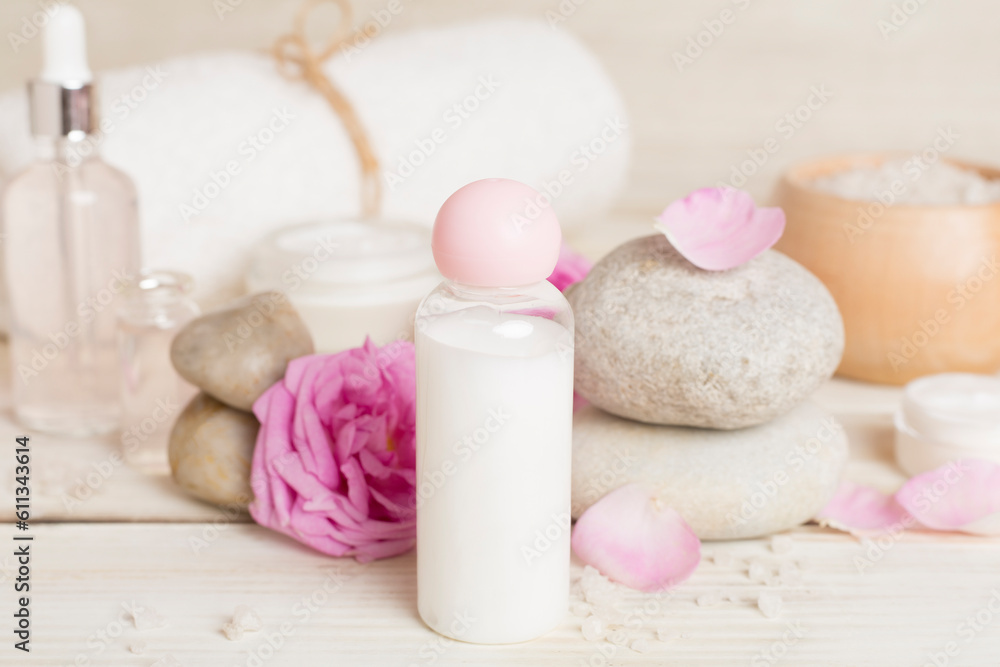 Spa composition with pink roses on wooden table Spa composition with pink roses on wooden table