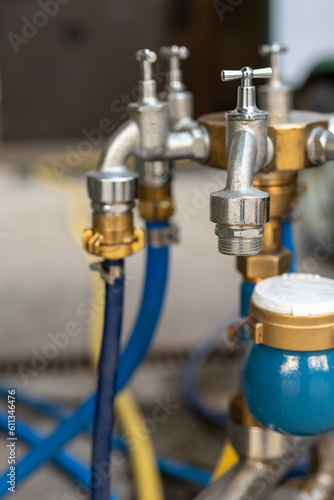 water tap connection with pipes in selective focus