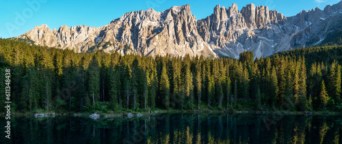 Fototapeta Naklejka Na Ścianę i Meble -  Captivating summer view of Carezza (Karersee) lake. Spectacular morning scene of Dolomiti Alps, Province of Bolzano, South Tyrol, Italy, Europe. Beauty of nature concept background.