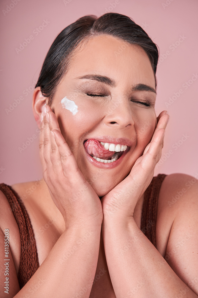 Vertical portrait of the happy body positive woman posing with beauty product on her face Vertical portrait of the happy body positive woman posing with beauty product on her face