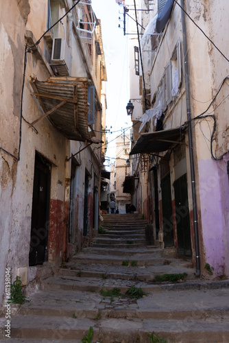 Algiers (Alger), Algeria : Street scene in the Casbah. Stone stairs and ancient ottoman houses. Chiaroscuro atmosphere.  © Bruno