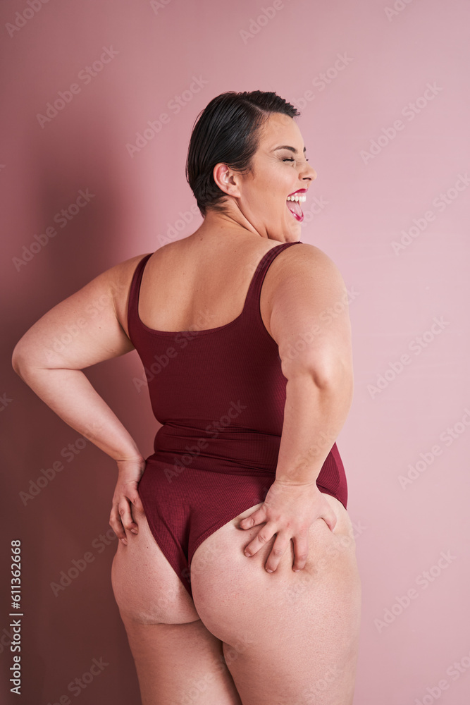 Back view of the overjoyed emotional body positive woman enjoying her natural body Back view of the overjoyed emotional body positive woman enjoying her natural body