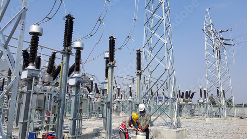 115kV Lightning Arrester testing at High voltage take-off tower by electrical engineer and commissioning team. photo