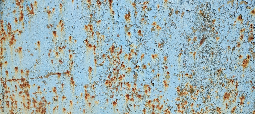 The texture of the iron panel, painted turquoise blue several times, with rust spots and paint stains. Photo, background.