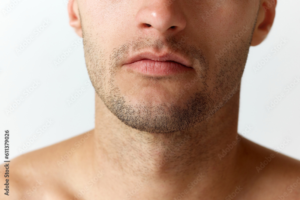 Cropped close-up image of male face with bristle against white studio background. Shaving. Concept of men's beauty, skincare, cosmetology, spa, health. Copy space for ad Cropped close-up image of male face with bristle against white studio background. Shaving. Concept of men's beauty, skincare, cosmetology, spa, health. Copy space for ad