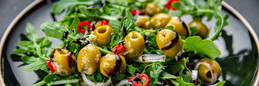 salad olives, hot chili peppers, green mix lettuce, arugula healthy meal food snack on the table copy space food background rustic top view keto or paleo diet veggie vegan or vegetarian food salad olives, hot chili peppers, green mix lettuce, arugula healthy meal food snack on the table copy space food background rustic top view keto or paleo diet veggie vegan or vegetarian food