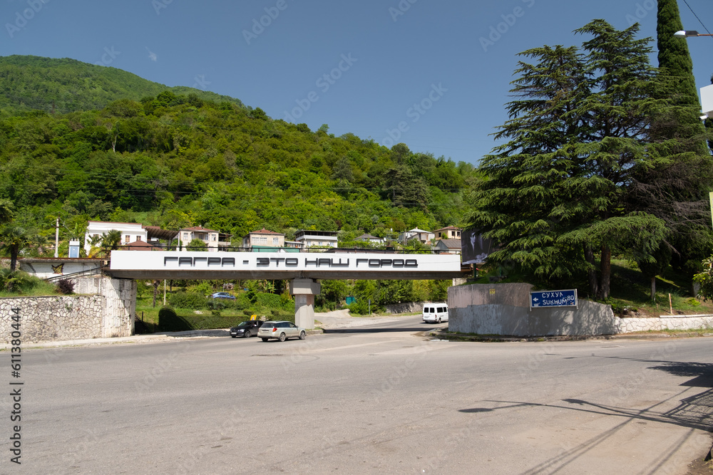Abkhazia Gagra 08.06.2023 The bridge over the road against the background of the mountain with the inscription Gagra is our city Abkhazia Gagra 08.06.2023 The bridge over the road against the background of the mountain with the inscription Gagra is our city