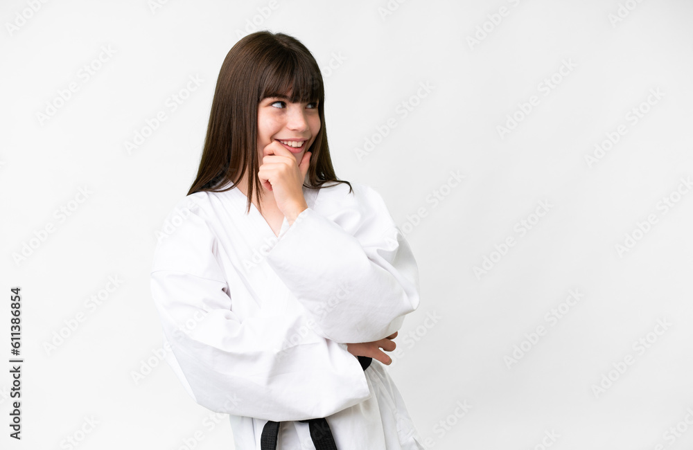 Little caucasian girl over isolated white background looking side Little caucasian girl over isolated white background looking side