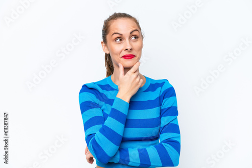 Young caucasian woman isolated on white background thinking an idea while looking up