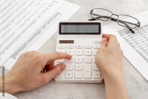 Office table with financial accounting and business planning with calculator