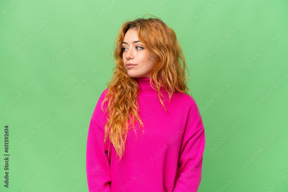 Young caucasian woman isolated on green screen chroma key background looking to the side Young caucasian woman isolated on green screen chroma key background looking to the side