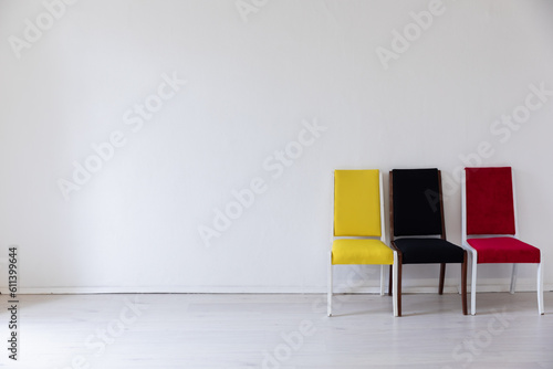 Fototapeta Naklejka Na Ścianę i Meble -  Chairs yellow red black in a bright room on a white background