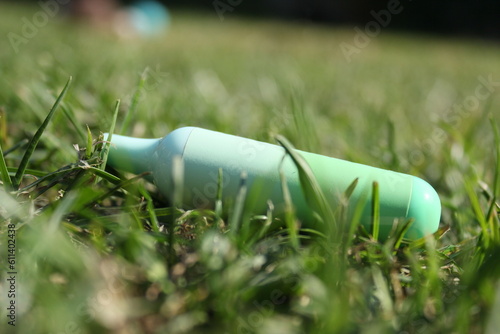 A discarded disposable vape pen in grass