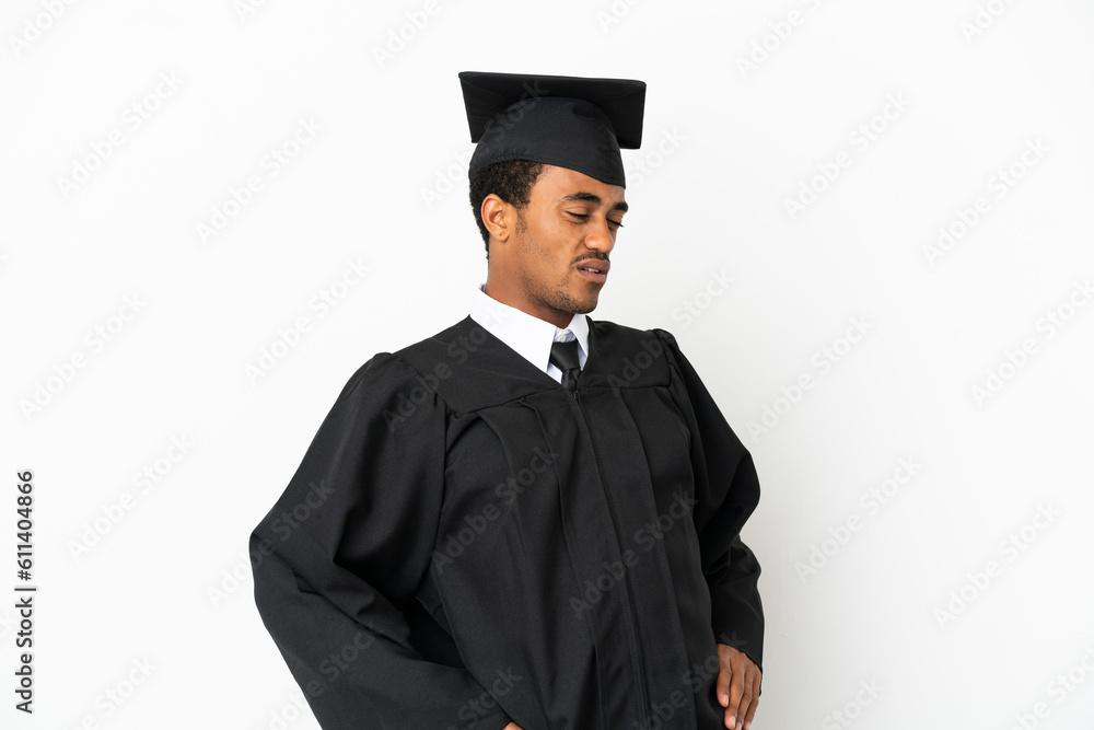 African American university graduate man over isolated white background suffering from backache for having made an effort African American university graduate man over isolated white background suffering from backache for having made an effort