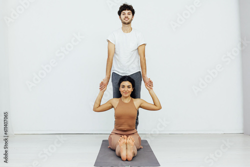 flexible body acrobatics yoga poses woman and man do gymnastics warm-up exercises stretching