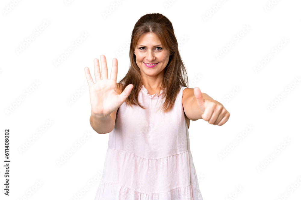 Middle age woman over isolated background counting six with fingers Middle age woman over isolated background counting six with fingers
