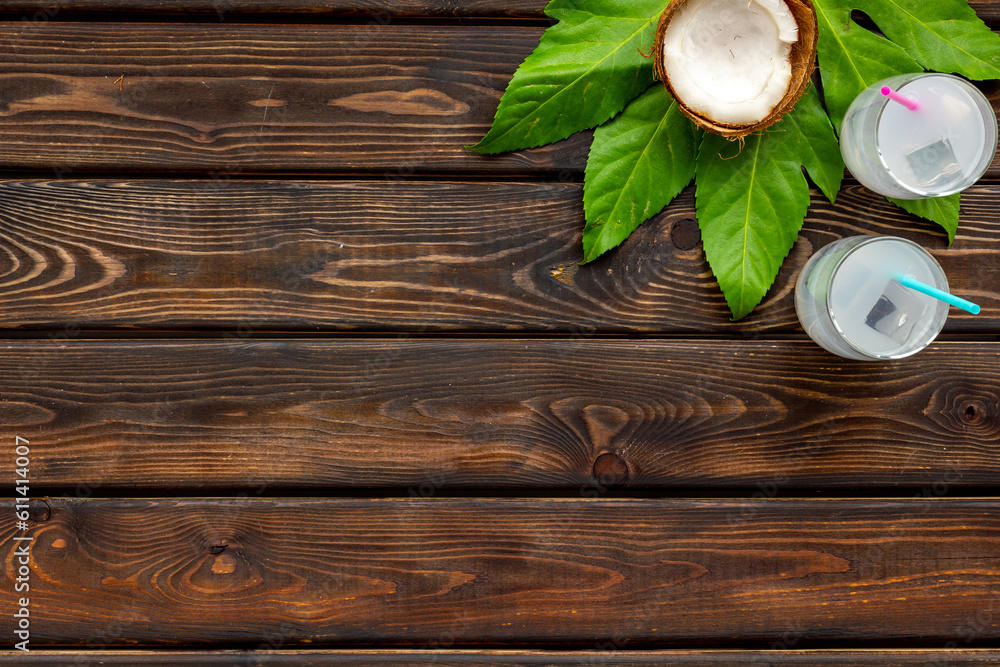Fresh summer coconut cocktail on a beach board. Vocation background Fresh summer coconut cocktail on a beach board. Vocation background
