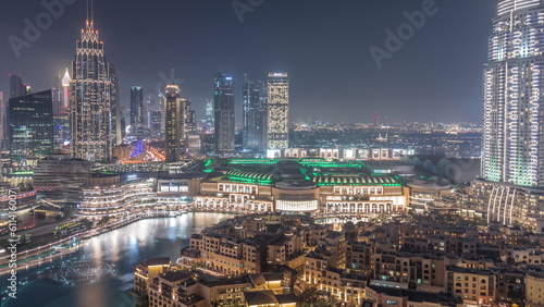 Aerial view of Dubai International Financial Centre district day to night timelapse