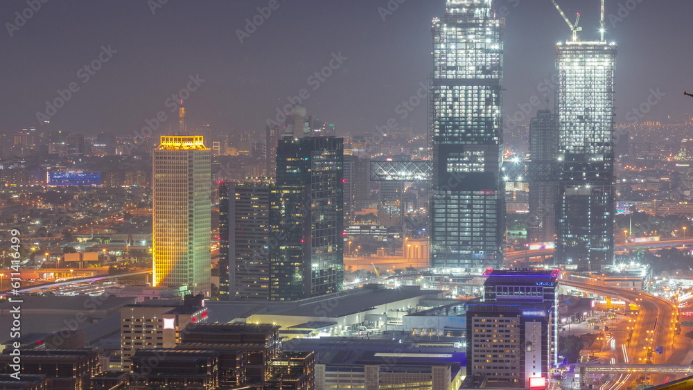 Aerial view of skyscrapers with World Trade center in Dubai day to night timelapse.