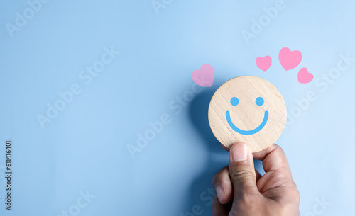 Fotografie, Obraz Hands holding blue happy smile face