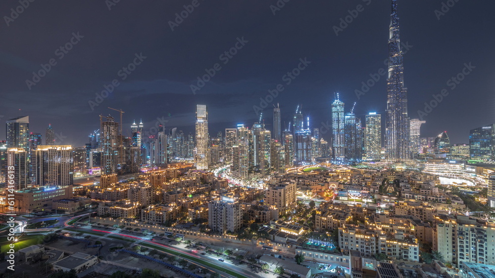 Fototapeta premium Dubai Downtown day to night transition timelapse with tallest skyscraper and other towers
