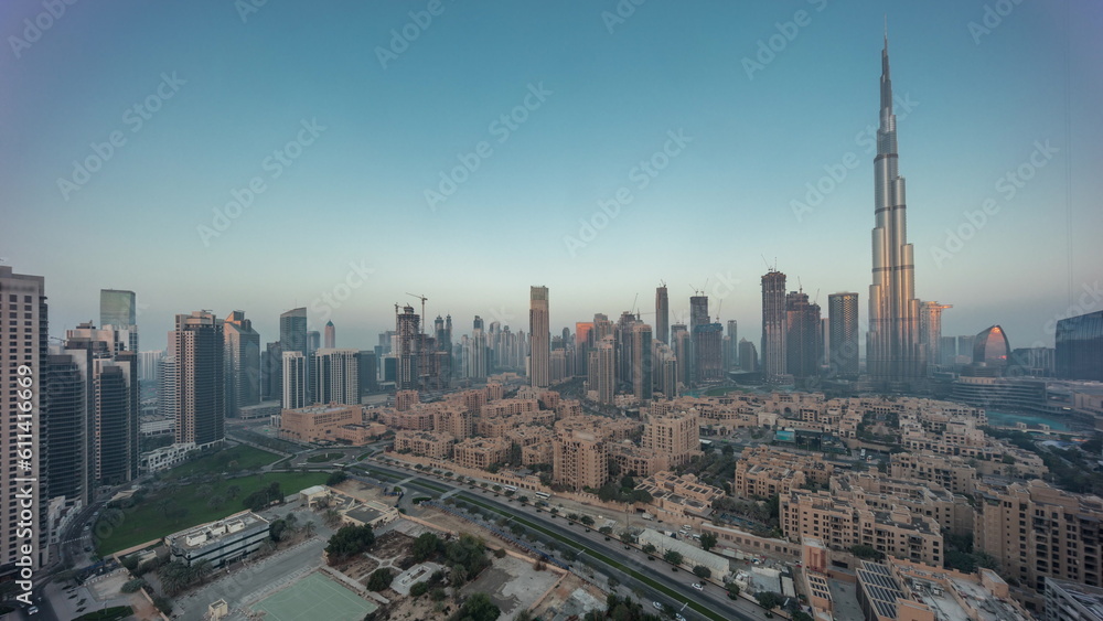 Fototapeta premium Dubai Downtown night to day timelapse with tallest skyscraper and other towers