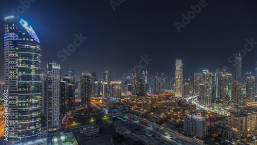 Panorama showing Dubai Downtown and business bay night timelapse with tallest skyscraper and other towers