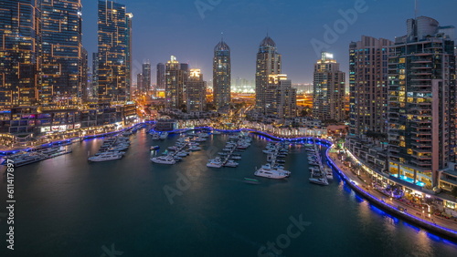 Luxury yacht bay in the city aerial day to night timelapse in Dubai marina