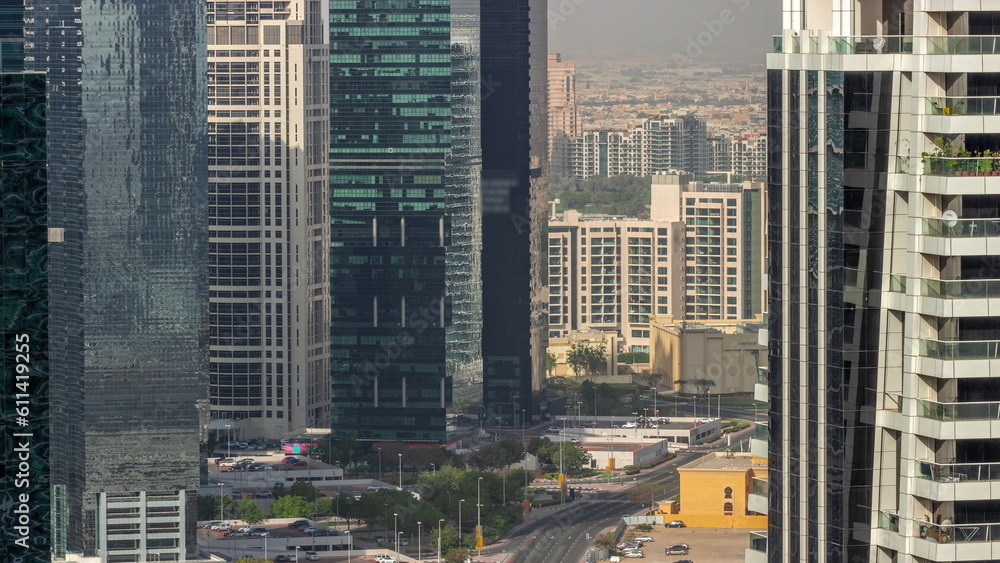 Fototapeta premium Tall residential buildings at JLT aerial timelapse, part of the Dubai multi commodities centre mixed-use district.