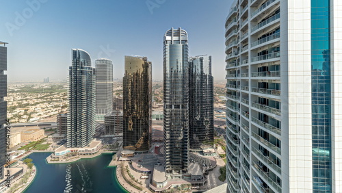 Panorama showing tall residential buildings at JLT aerial timelapse, part of the Dubai multi commodities centre mixed-use district. © neiezhmakov