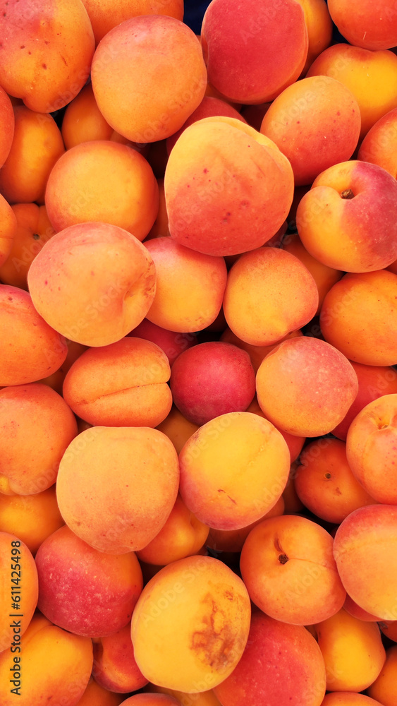 Ripe apricots fruit on a street fruit vegetables market, ecological food, background. Ripe apricots fruit on a street fruit vegetables market, ecological food, background.